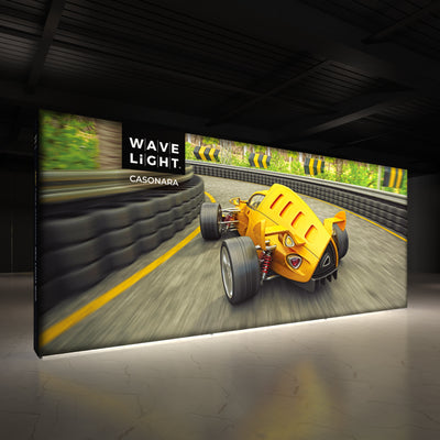 Large illuminated display booth with racing car graphic for trade shows and exhibitions