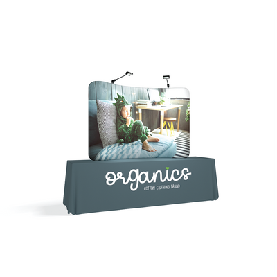 Curved table top display with child image and branded tablecloth for trade shows and exhibitions