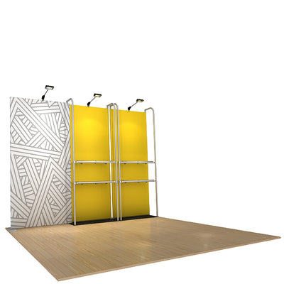 Trade show display setup with modular panel walls, shelving, and overhead spotlights on wooden floor