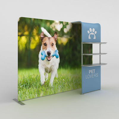 Trade show display with large pet-themed backdrop featuring dog with toy and branded shelving unit