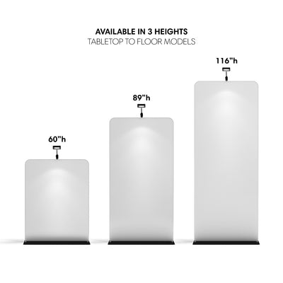 Three blank trade show banner stands in varying heights with attached lights for exhibitions and events