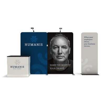 Trade show display featuring branded pop-up banners and counter with motivational business messaging