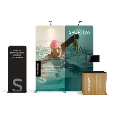 Trade show display with SPORTIVA branding, swimmer graphic, signage, and demo counter for exhibitions