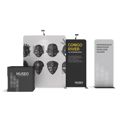 Trade show display with museum branding, African art backdrop, info panels, and exhibition counter