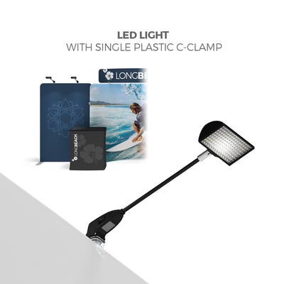 LED light with plastic C-clamp attached to trade show display for exhibitions and special events