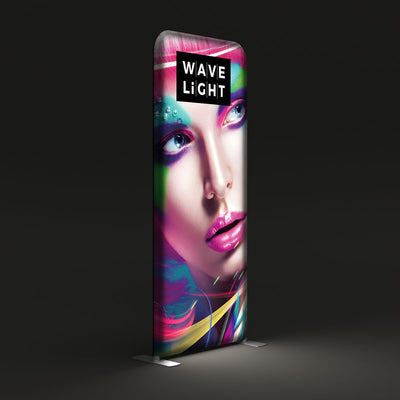 Tall illuminated Wavelight display featuring vibrant artistic face graphic for trade shows and exhibitions