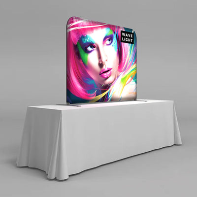Backlit tabletop display with vibrant graphic for trade shows and special events on covered table