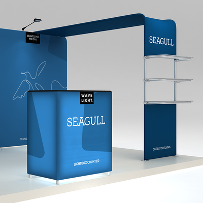 Trade show display system featuring lightbox counter and shelving for exhibitions and events