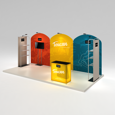 Trade show exhibit display system with curved backdrops, monitor stand, shelving units, and lightbox counter