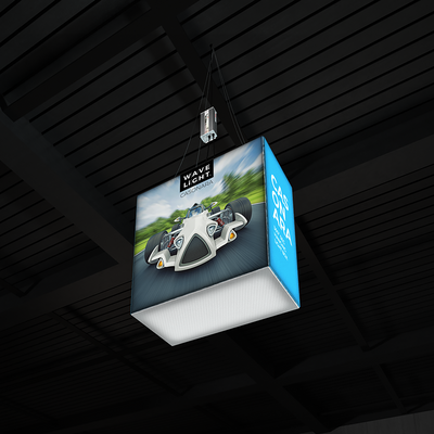 Suspended illuminated cube display featuring racing car graphic for trade shows and exhibitions