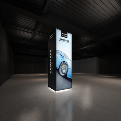 Illuminated 360-degree light box tower display for trade shows and exhibitions featuring automotive graphics