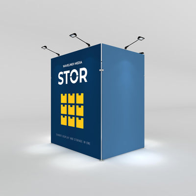 Trade show exhibit display with STOR storage system featuring backlit panels and adjustable spotlights