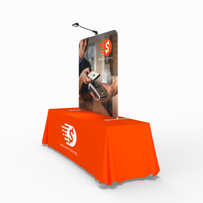 Trade show table display with branded backdrop and LED light for merchant services promotion