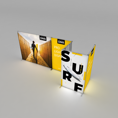 Trade show display featuring large backlit panels with surf-themed graphics and branding